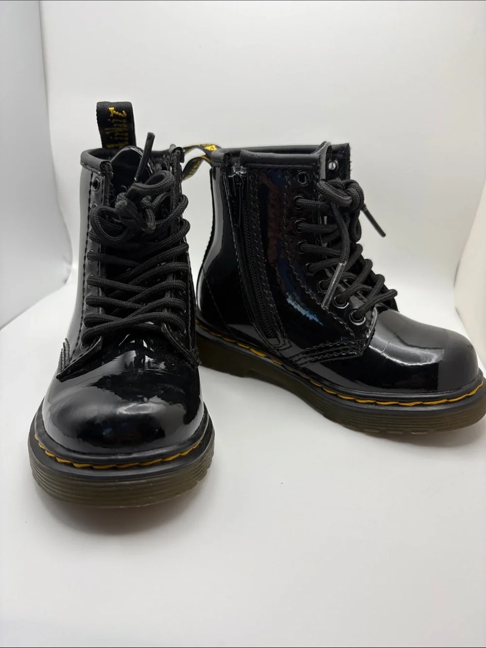 Dr. Martens Kids Glossy Black Patent Lace-Up Boots with Yellow Stitching